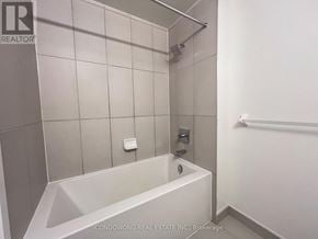 Toronto (Waterfront Communities) condo for rent - A white bathroom with a tub and a shower.