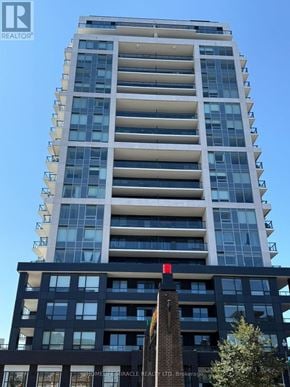 Grimsby (Grimsby Beach) condo for rent - A tall building with a sign that reads "REALTOR" on the top left corner.