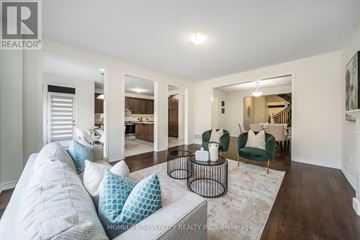 Vaughan (Kleinburg) apartment for rent - A living room with a grey couch and a coffee table.