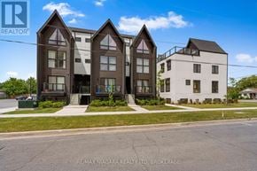 Niagara Falls (Oldfield) condo for rent - A building with a sign that says RE/MAX Niagara Realty Ltd, Brokerage.