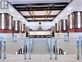 Markham (Unionville) condo for rent - A large open space with a staircase in the middle.