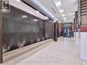 Markham (Unionville) condo for rent - A hallway with a black wall and a white floor.