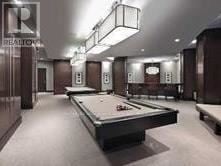 Markham (Unionville) condo for rent - A pool table in a room with a Realty sign.