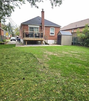 Toronto (Wexford-Maryvale) apartment for rent - A house with a deck and a garage.