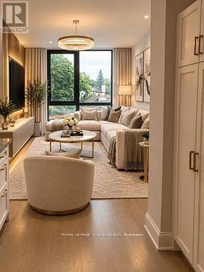 Toronto (Englemount-Lawrence) condo for rent - A well-lit, spacious living room with a large window and a comfortable seating area.
