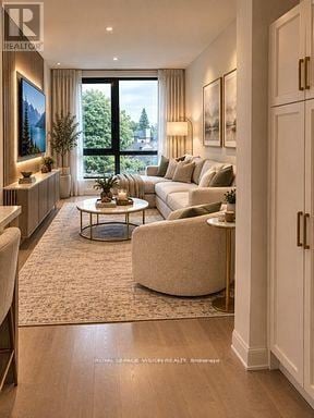 Toronto (Englemount-Lawrence) condo for rent - A modern living room with a large window and a view of trees outside.