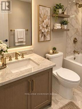 Toronto (Englemount-Lawrence) condo for rent - A bathroom with a toilet, sink, and bathtub.