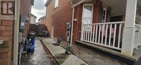 Milton (Ha Harrison) apartment for rent - A narrow alley with a Realty sign on the left.