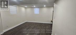 Milton (Ha Harrison) apartment for rent - A room with a window and a wooden floor.