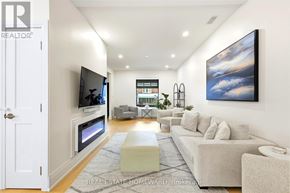 Toronto (High Park-Swansea) apartment for rent - A modern living room with a flat screen TV mounted on the wall.
