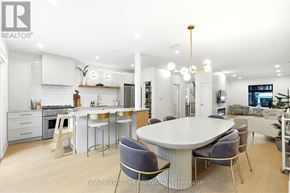 Toronto (High Park-Swansea) apartment for rent - A modern kitchen with a dining table and chairs.