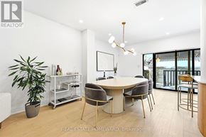 Toronto (High Park-Swansea) apartment for rent - A modern dining room with a round table and chairs.