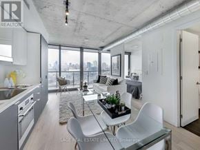 Toronto (Waterfront Communities) condo for rent - A modern kitchen with a view of the city.