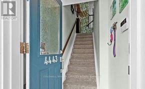 Ottawa condo for rent - A blue door with a sign that says "No Jumping" on it.