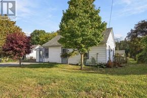 Prince Edward County (Picton Ward) apartment for rent - A white house with a tree in front of it.
