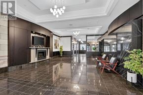 Ottawa condo for rent - A spacious lobby with a fireplace and seating area.