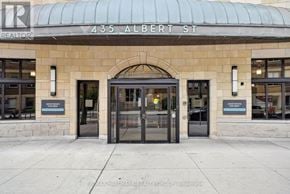 Ottawa condo for rent - The front of a building with a glass door and a sign that says REALTOR.