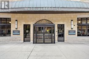 Ottawa condo for rent - The front of a building with a glass door and a sign that says REALTOR.