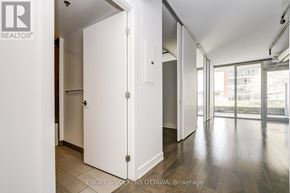 Ottawa condo for rent - A white door in a room with wooden floors and white walls.