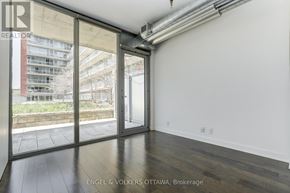 Ottawa condo for rent - A room with a sliding door leading to a balcony.