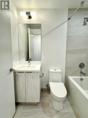 Toronto (Waterfront Communities) condo for rent - A white bathroom with a sink, toilet and bathtub.
