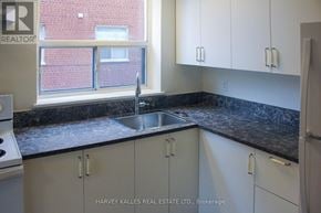 Toronto (Englemount-Lawrence) multi-family for rent - A kitchen with a sink and cabinets.