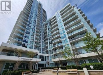 Toronto (Parkwoods-Donalda) condo for rent - A modern apartment complex with a glass facade and a sign that reads "10 Deerlick Courts".