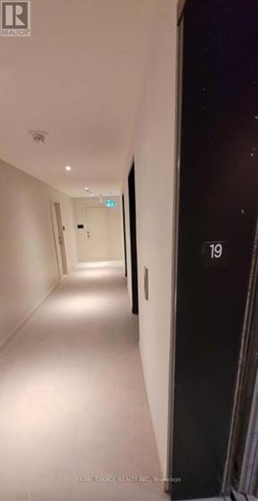 Toronto (Parkwoods-Donalda) condo for rent - A hallway with a door numbered 19 on the right.