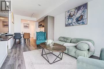 Toronto (Church-Yonge Corridor) condo for rent - A living room with a green couch and a coffee table.