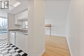 Toronto (Dorset Park) condo for rent - A kitchen with a checkered floor and a white wall.