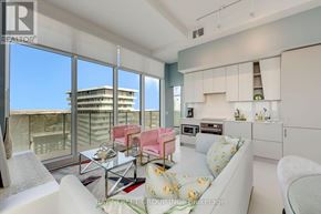 Mississauga (City Centre) house for rent - A modern living room with a view of the cityscape outside the large windows.