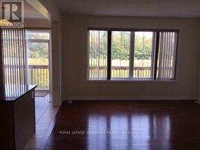 Brampton (Credit Valley) apartment for rent - A room with a large window and wooden flooring.