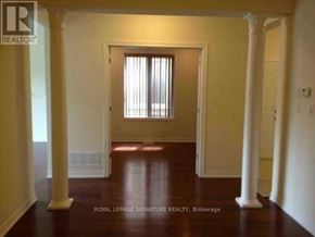 Brampton (Credit Valley) apartment for rent - A room with a doorway and pillars.