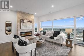 Guelph (Pineridge/Westminster Woods) condo for rent - A living room with a fireplace and a couch.