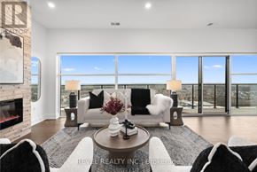 Guelph (Pineridge/Westminster Woods) condo for rent - A living room with a fireplace and a view of the city.