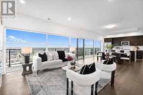 Guelph (Pineridge/Westminster Woods) condo for rent - A modern living room with a view of the city.