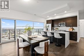 Guelph (Pineridge/Westminster Woods) condo for rent - A modern kitchen with a dining table and chairs.