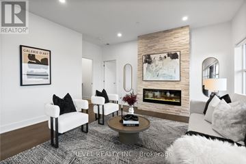 Guelph (Pineridge/Westminster Woods) condo for rent - A living room with a fireplace and a painting on the wall.