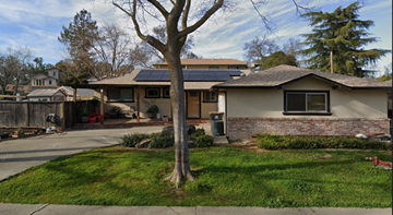 Davis apartment for rent - A house with a tree in front of it.
