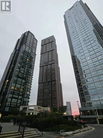 Vaughan (Concord) condo for rent - Three tall buildings are shown in the image.