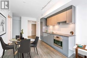 Toronto (Mount Pleasant West) condo for rent - A modern kitchen with a dining table and chairs.