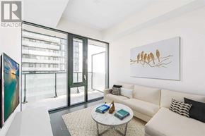 Toronto (Mount Pleasant West) condo for rent - A living room with a couch, a coffee table, and a painting on the wall.