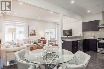 Milton (Ha Harrison) apartment for rent - A modern living room with a glass table and comfortable seating.