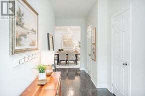 Milton (Ha Harrison) apartment for rent - A hallway with a wooden bench and a painting on the wall.