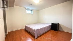 Toronto (Hillcrest Village) apartment for rent - A bedroom with a bed, a window, and a black speaker.