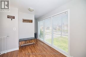St. Catharines (Western Hill) apartment for rent - A room with a sliding glass door and a bench.