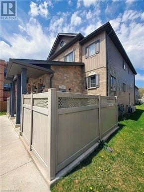 London South (South W) townhouse for rent - A house with a grey fence in front of it.