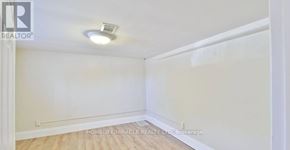 Oshawa (Central) apartment for rent - A room with a white ceiling and walls, and a wooden floor.