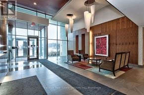 Mississauga (Clarkson) condo for rent - A large, well-lit lobby with a reception desk and chairs.