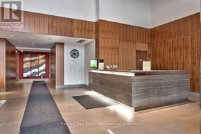 Mississauga (Clarkson) condo for rent - A reception area with a wooden wall and a reception desk.